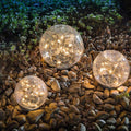 Tuinlamp op zonne-energie met glazen kogel met barsten